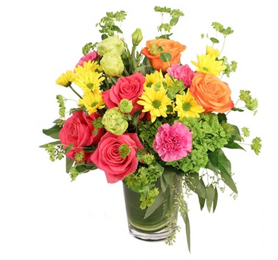 Vibrant floral arrangement featuring pink roses, orange roses, yellow daisies, and pink carnations in a clear glass vase with greenery accents.