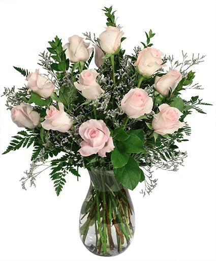 Classic Dozen Soft Pink Roses in glass vase.